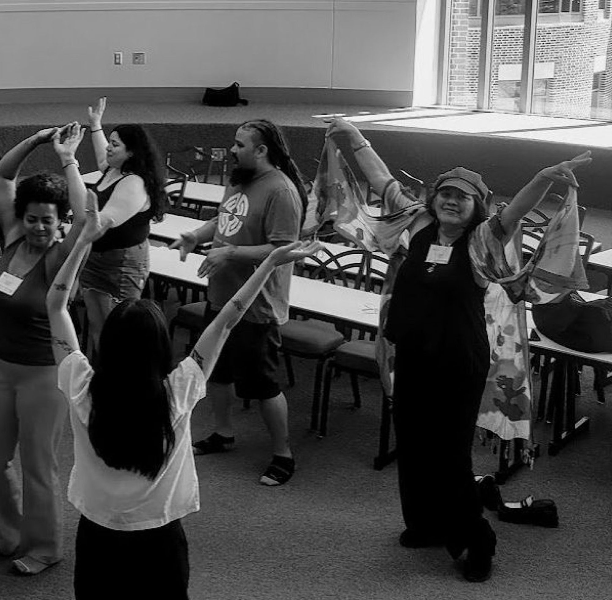 12 people dance in a classroom